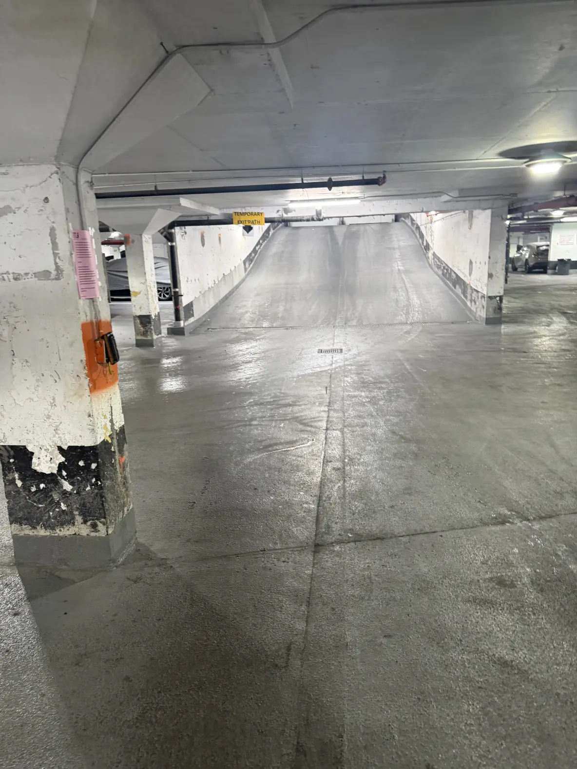 Inside the garage: tap your fob on the orange reader to open the exit.