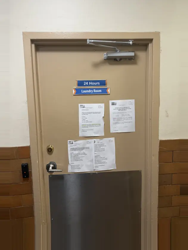 Laundry room door with the fob reader on the left. Tap your fob to unlock.