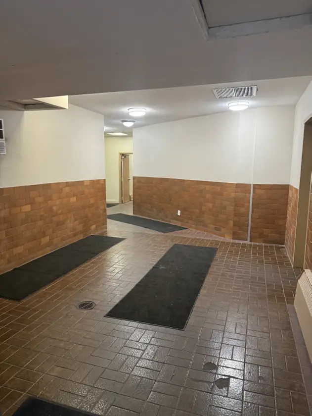 Hallway: the laundry facilities are ahead. Turn right.