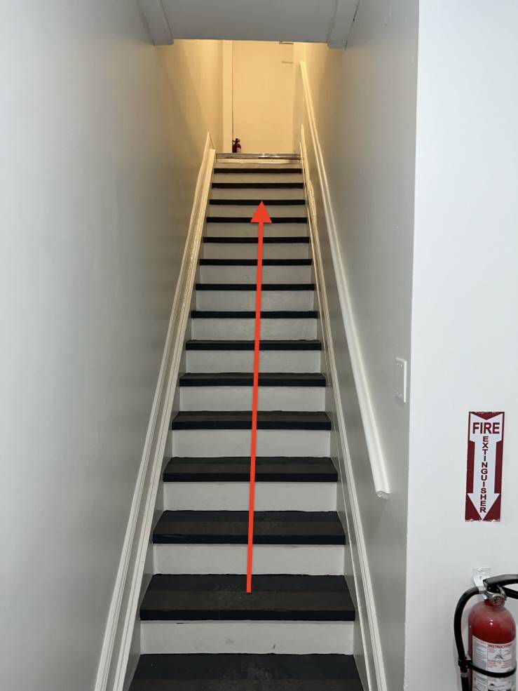 Stairs up to the top floor