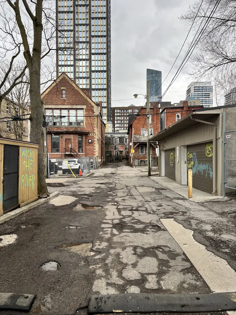 Glenholme Place laneway. Turn right at the speed bump sign, shown circled in the distance.