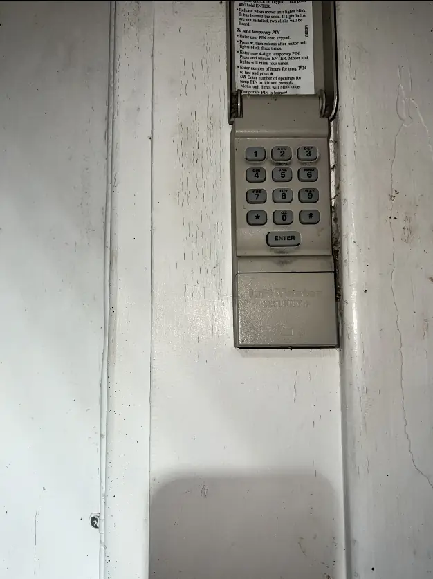 Garage door keypad. Open the cover, enter the code and press Enter.