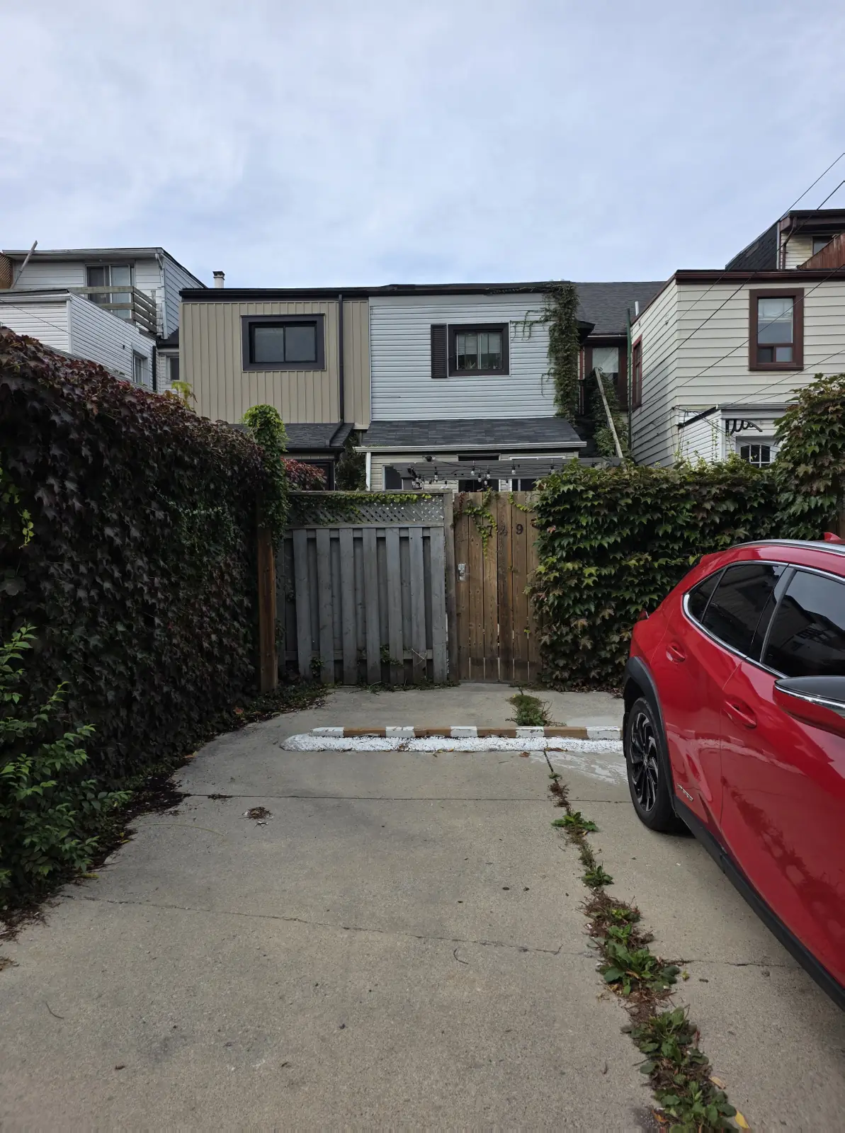 Parking pad behind 749 Gerrard. Park on the left side.